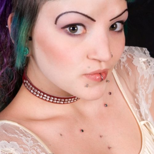 Body-piercing-studs-spread-on-the-brest-and-lips